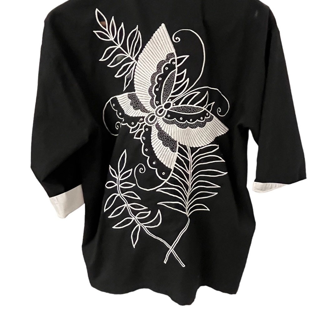 CC embroidered blouse. Button down  pit to pit 19” fits a medium.